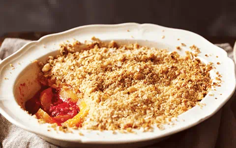 recipe image Koláč s vanilkovým krémem a broskvemi